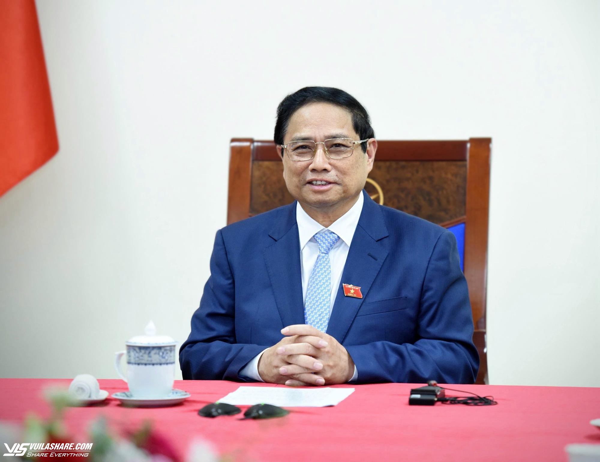 Thủ tướng Phạm Minh Chính mời tân Thủ tướng Singapore Lawrence Wong sớm thăm Việt Nam- Ảnh 1.