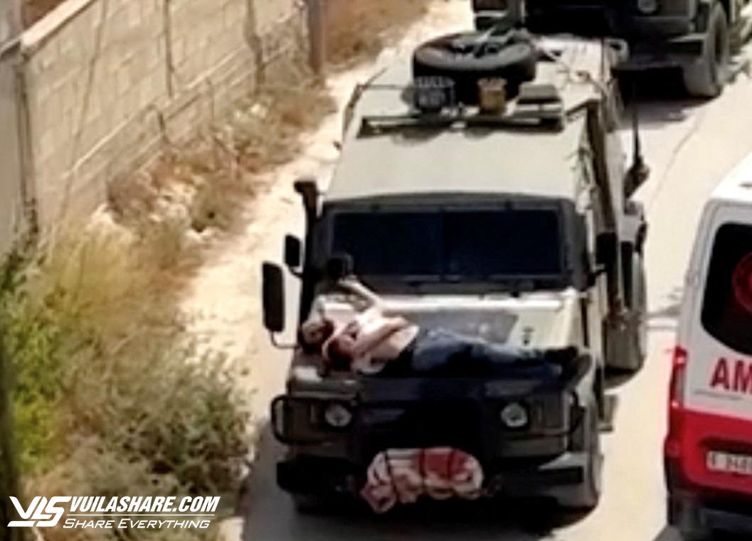 Mỹ nói gì về video người Palestine bị thương bị binh sĩ Israel trói vào xe?- Ảnh 1.